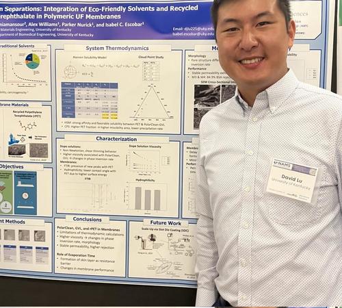 David Lu in front of his research poster