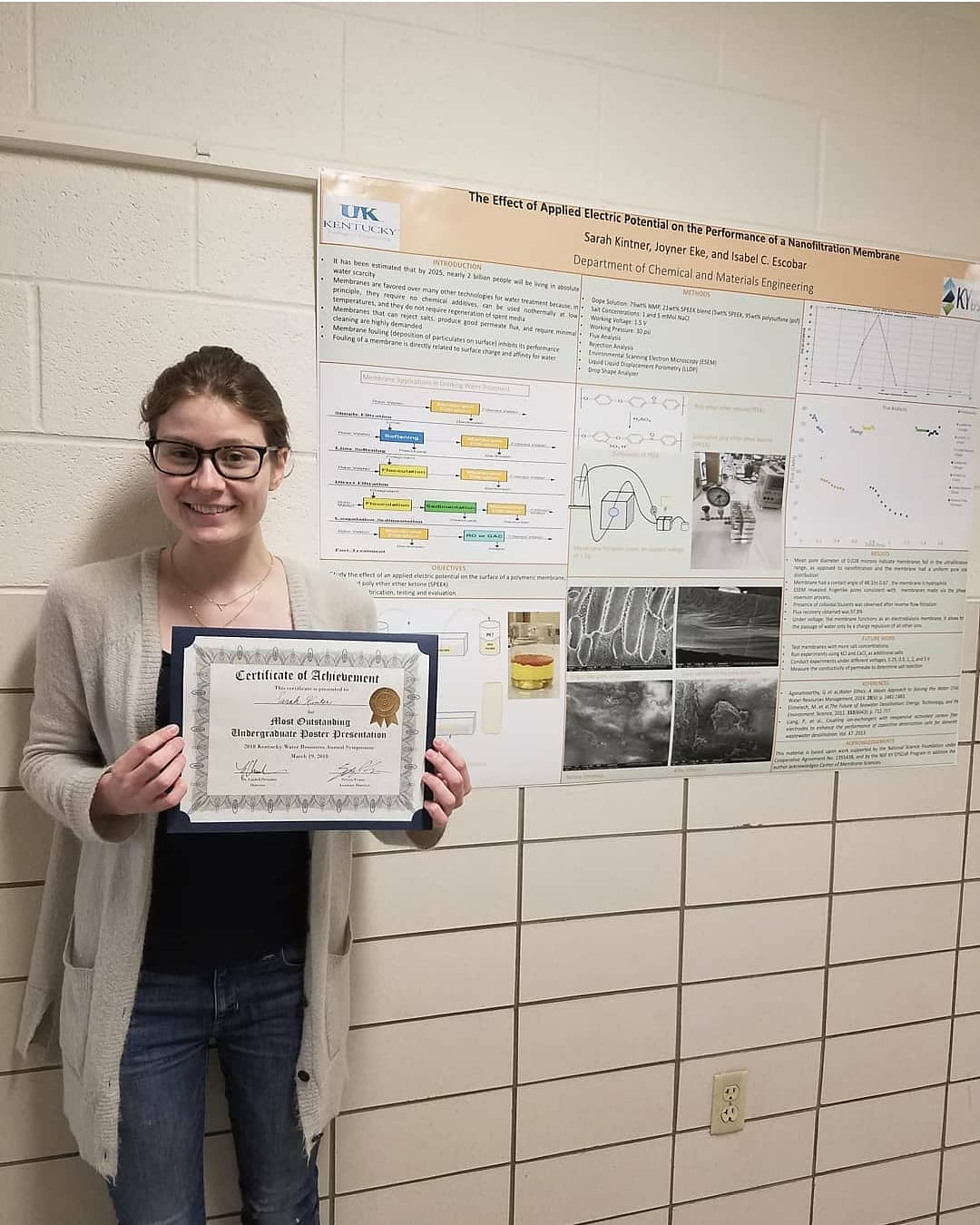  Sarah Kintner with her “Most Outstanding Undergraduate Poster Presentation” certificate. 