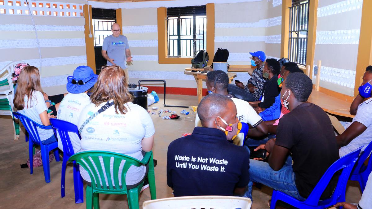 Professor Jeff Seay conducts a training session on the Trash-to-Tank Processor for the staff of Upcycle Africa in Mpigi, Uganda.